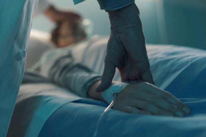 Doctor assisting a young patient at the hospital